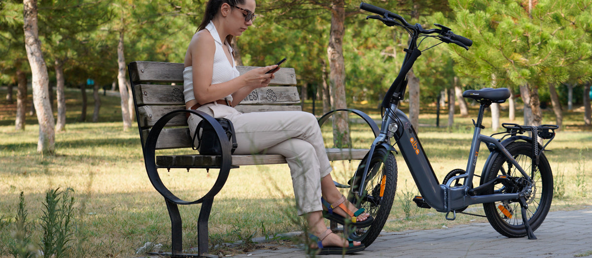 Alba Fold X Electric bike in a park on a summers day