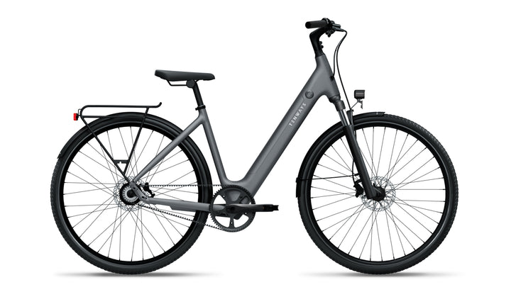 Side profile of Tenways 800S electric bike in Pebble Grey with a step-through frame, integrated battery, belt drive system, front suspension fork, and rear rack.