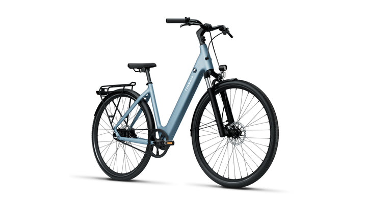 Front-right profile of Tenways 800S electric bike in Sky Blue with a step-through frame, integrated battery, belt drive system, front suspension fork, and rear rack.